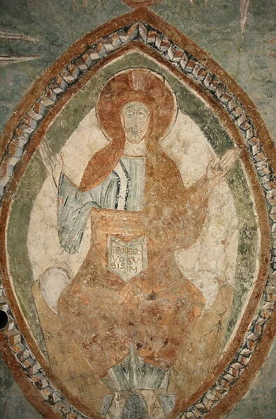 A 12th century Romanesque fresco depicting Jesus Christ in Saint Chef abbey church