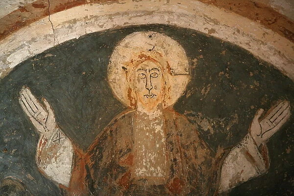 A 12th century Romanesque fresco depicting Jesus Christ in St