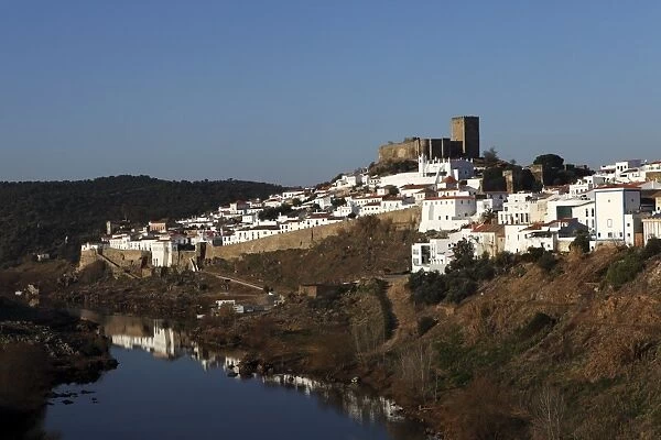 The 13th century and medieval walled city of Mertola, which has a long Islamic history, by the Guadiana River, Alentejo, Portugal, Europe