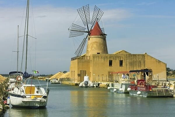 The 16th century windmill at the Ettore and Infersa Saltworks by the Stagnone Lagoon salt pan area south of Trapani, Marsala, Sicily, Italy, Mediterranean, Europe