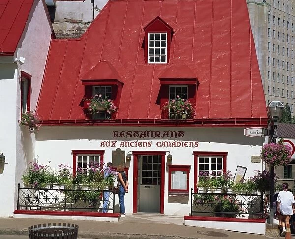 A 17th century house with red roof, now a restaurant, in Quebec City, Quebec
