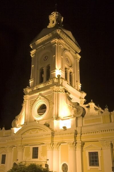 The 19th century Church of San Francisco illuminated at night on Plaza San Francisco in this attractive colonial capital, Cuenca, Azuay Province, Southern Highlands, Ecuador