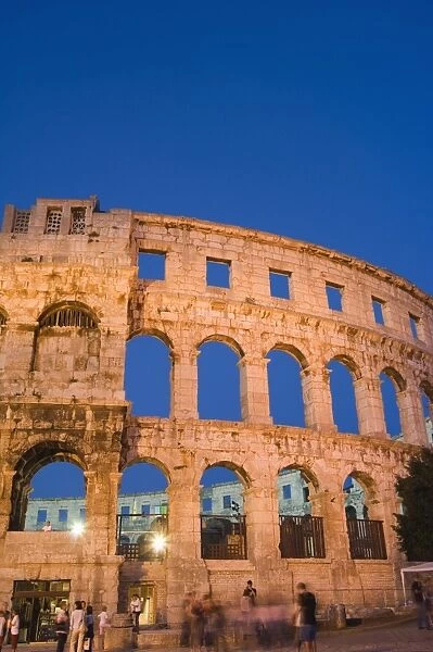 The 1st century Roman amphitheatre bathed in early evening light, Pula