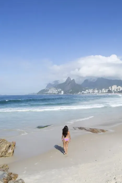 Framed Print : A 20-25 year old young Brazilian woman on Ipanema Beach with the Morro Dois Irmaos Framed Print : A 20-25 year old young Brazilian woman on Ipanema Beach with the Morro Dois Irmaos