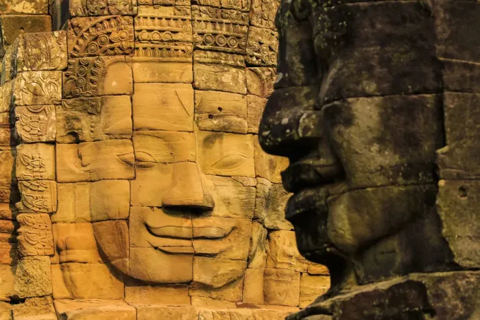 Framed Print : Two of 216 smiling sandstone faces at 12th century Bayon, King Jayavarman VIIs last Framed Print : Two of 216 smiling sandstone faces at 12th century Bayon, King Jayavarman VIIs last
