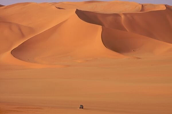 A 4x4 vehicle on the dunes of the erg of Murzuk in the Fezzan desert, Libya
