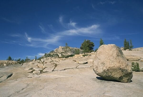 614-278. Boulder on rocky arid landscape in the Tioga Pass area of Nevada