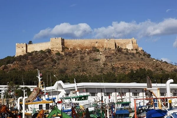 The 6th century Byzantine Fortress overlooking fishing boats in the harbour