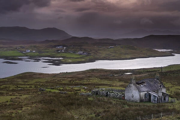 Abandoned Croft backed by Loch Eireasort and the Harris Hills, near Baile Ailein