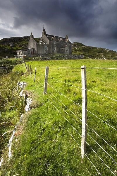 Abandoned croft beneath a stormy sky in the township of Manish on the east coast of The Isle of Harris, Outer Hebrides, Scotland