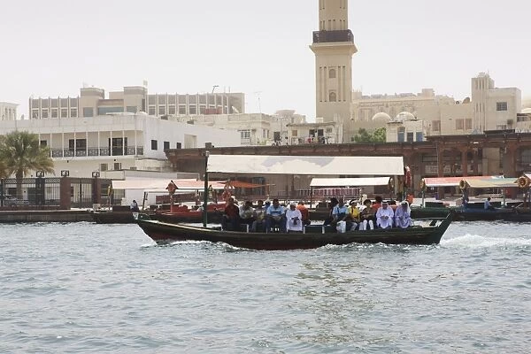 Abra water taxi crossing The Creek between Dur Dubai and Deira, Dubai, United Arab Emirates