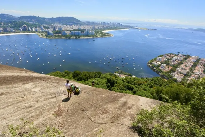 Framed Print : Abseilers in Morro da Urca in Rio de Janeiro with panoramic view in the background Framed Print : Abseilers in Morro da Urca in Rio de Janeiro with panoramic view in the background