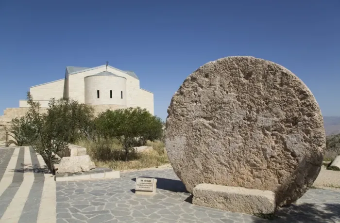 Framed Print : Abu Badd, a rolling stone used to fortify a door, Moses Memorial Church in the background Framed Print : Abu Badd, a rolling stone used to fortify a door, Moses Memorial Church in the background