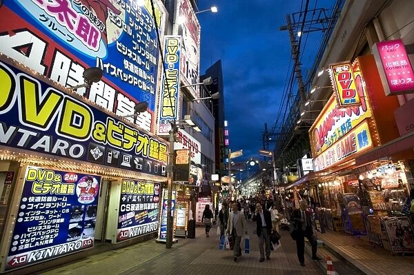 Adult shops line a busy street in the entertainment district of Okachimachi