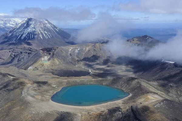 Aerial of a blue lake with Mount Ngauruhoe in the background, Tongariro National Park, UNESCO World Heritage Site, North Island, New Zealand, Pacific