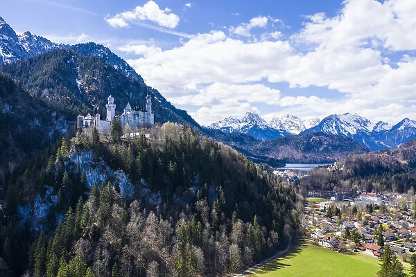Aerial of Castle Neuschwanstein, with the Alps behind, Schwangau, Bavaria, Germany