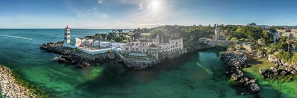 Aerial drone panoramic view of Santa Marta, Santa Marta House Museum and Condes de Castro Guimaraes Museum next to turquoise water in Cascais, Lisbon Region, Portugal, Europe