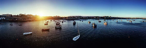 Aerial drone panoramic view of sunset at Cascais Bay, in the Lisbon region of the Portuguese Riveira, Europe