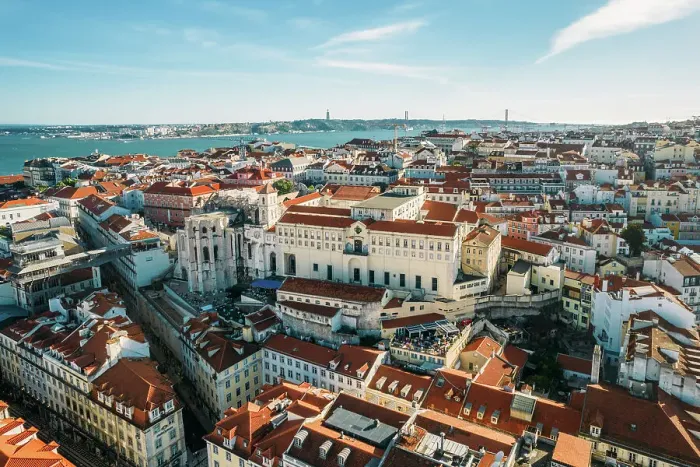 Framed Print : Aerial drone view of Carmo Church and surrounding historic neighbourhood in Chiado, with Tagus River and 25 April Bridge visible, Lisbon, Portugal, Europe Framed Print : Aerial drone view of Carmo Church and surrounding historic neighbourhood in Chiado, with Tagus River and 25 April Bridge visible, Lisbon, Portugal, Europe