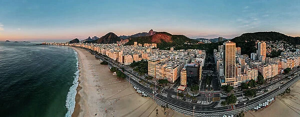 Aerial drone view of Copacabana Beach and urban setting at sunrise, UNESCO World Heritage Site, Rio de Janeiro, Brazil, South America