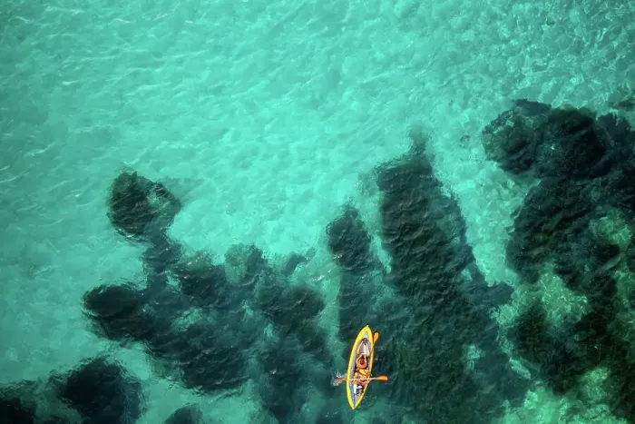 Framed Print : Aerial drone above view of a kayak on the turquoise water of Mediterranean Sea, Sardinia, Italy, Mediterranean, Europe Framed Print : Aerial drone above view of a kayak on the turquoise water of Mediterranean Sea, Sardinia, Italy, Mediterranean, Europe