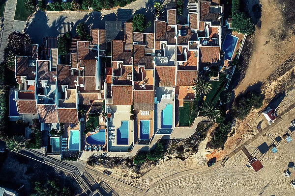 Aerial drone top down view of luxurious residences in Vale do Lobo, iconic beachfront resort and home, near Quarteira in Algarve, Portugal, Europe