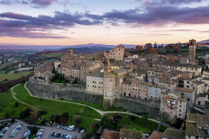Framed Print : Aerial drone view of traditional old village with iconic monuments at sunset, Anghiari, Tuscany, Italy, Europe