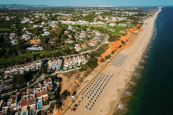 Aerial drone view of Vale do Lobo Beach, iconic beachfront resort and home, near Quarteira in Algarve, Portugal, Europe