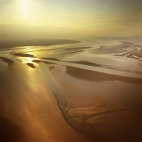 Aerial image of mudflats at sunset, Solway Firth, border between Cumbria in England