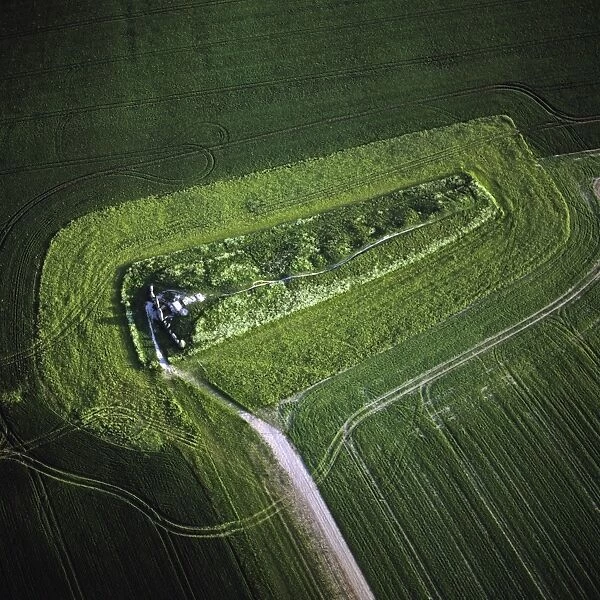 Aerial image of West Kennet Long Barrow, a Neolithic tomb or barrow, on a prominent chalk ridge