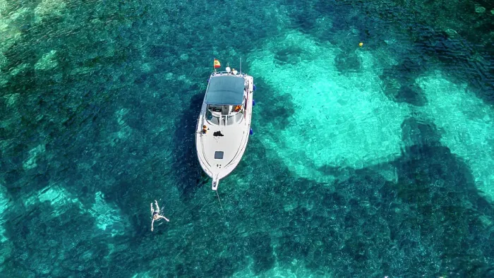 Framed Print : Aerial of a little motorboat in a bay on the Formentor Peninsula, Mallorca, Balearic islands, Spain, Mediterranean, Europe Framed Print : Aerial of a little motorboat in a bay on the Formentor Peninsula, Mallorca, Balearic islands, Spain, Mediterranean, Europe