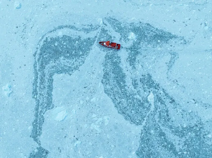 Framed Print : Aerial of a little ship floating between the ice below the Eqi glacier, Western Greenland, Denmark, Polar Regions Framed Print : Aerial of a little ship floating between the ice below the Eqi glacier, Western Greenland, Denmark, Polar Regions
