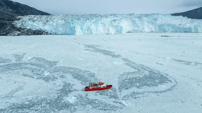 Framed Print : Aerial of a little ship floating between the ice below the Eqi glacier, Western Greenland, Denmark, Polar Regions Framed Print : Aerial of a little ship floating between the ice below the Eqi glacier, Western Greenland, Denmark, Polar Regions