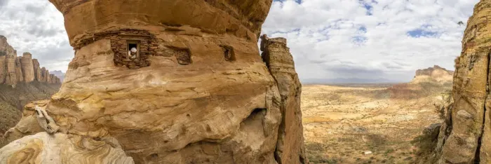 Framed Print : Aerial panoramic by drone of priest looking out from Abuna Yemata Guh rock-hewn church Framed Print : Aerial panoramic by drone of priest looking out from Abuna Yemata Guh rock-hewn church