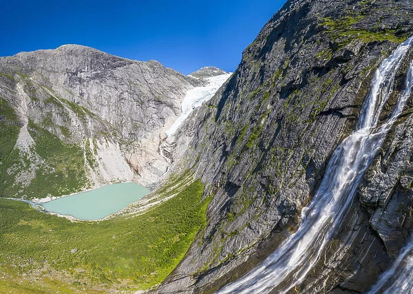 Aerial panoramic by drone of waterfall above Briksdalsbreen glacier, Loen, Jostedalsbreen