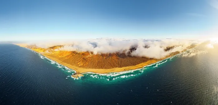 Framed Print : Aerial panoramic of golden sand of Cofete beach washed by the crystal sea, Jandia Natural Park, Fuerteventura, Canary Islands Framed Print : Aerial panoramic of golden sand of Cofete beach washed by the crystal sea, Jandia Natural Park, Fuerteventura, Canary Islands