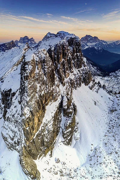 Aerial panoramic of majestic Nuvolau, Monte Pelmo and Civetta covered with snow at sunset