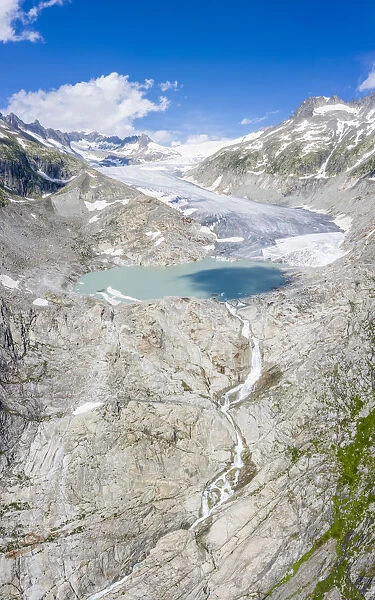 Aerial panoramic of Rhone Glacier and glacial lake at its base, Gletsch, Canton of Valais
