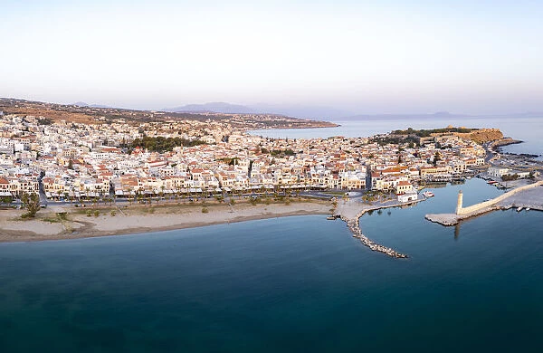 Aerial panoramic view of the old Venetian harbor and medieval town of Rethymno at sunrise, Crete island, Greek Islands, Greece, Europe