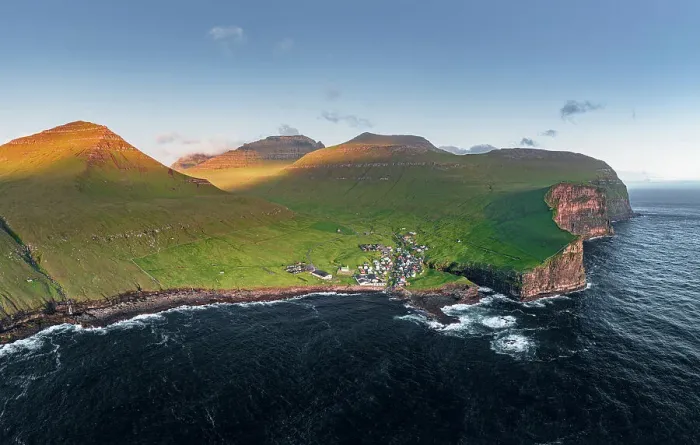 Framed Print : Aerial panoramic view of the village of Gjogv on cliffs washed by the ocean, Eysturoy Island, Faroe Islands, Denmark, Europe Framed Print : Aerial panoramic view of the village of Gjogv on cliffs washed by the ocean, Eysturoy Island, Faroe Islands, Denmark, Europe