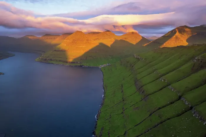 Framed Print : Aerial shot of the dramatic view of Funningur with pink sky at dawn, Eysturoy island, Faroe islands, Denmark, Europe Framed Print : Aerial shot of the dramatic view of Funningur with pink sky at dawn, Eysturoy island, Faroe islands, Denmark, Europe