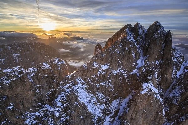 Aerial shot of Sassolungo at sunset, Sella Group, Val Gardena in the Dolomites, Val Funes