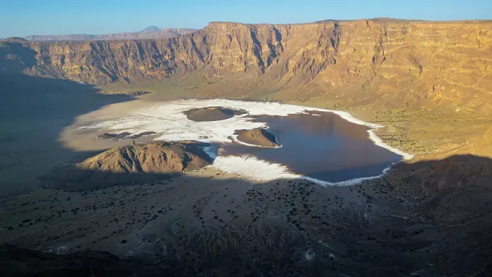 Framed Print : Aerial of the Trou du Natron volcanic crater and its natron lakes, Tibesti Mountains, Chad Framed Print : Aerial of the Trou du Natron volcanic crater and its natron lakes, Tibesti Mountains, Chad