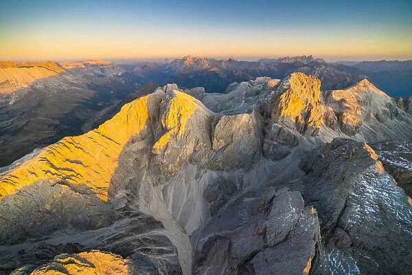 Aerial view of autumn sunset over the majestic peaks of Catinaccio Group, Dolomites