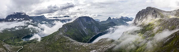 Aerial view of Barden, Breidtinden, Segla mountains and Ornfjord in a sea of clouds
