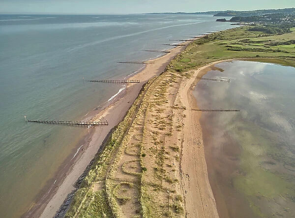 Aerial view of beach and dunes at Dawlish Warren, guarding the mouth of the River Exe, looking south along the coast towards the town of Dawlish, Devon, England, United Kingdom, Europe