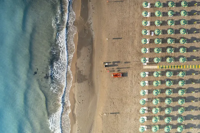 Framed Print : Aerial view of beach umbrellas and sunbeds in tidy rows during summer, Vieste Framed Print : Aerial view of beach umbrellas and sunbeds in tidy rows during summer, Vieste