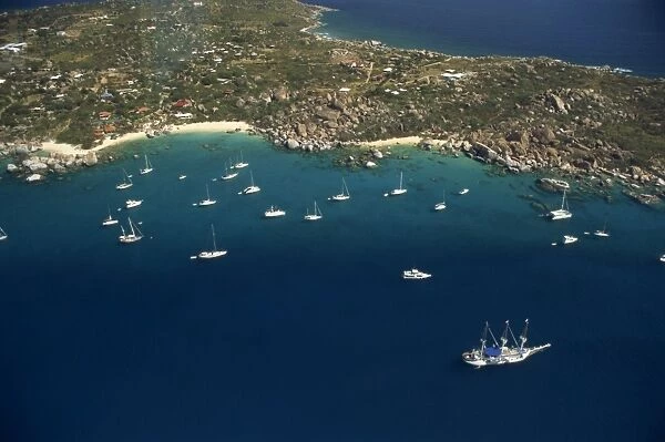 Aerial view over boats moored off the coast of St