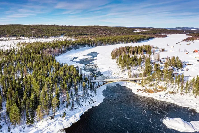 Framed Print : Aerial view of bridge above the scenic Jockfall waterfall in winter, Overkalix, Norrbotten county, Lapland Sweden Framed Print : Aerial view of bridge above the scenic Jockfall waterfall in winter, Overkalix, Norrbotten county, Lapland Sweden