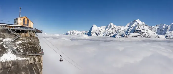 Framed Print : Aerial view of cable car in fog with Eiger, Monch, Jungfrau peaks in the background Framed Print : Aerial view of cable car in fog with Eiger, Monch, Jungfrau peaks in the background